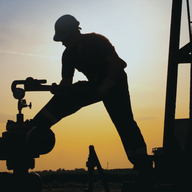 Worker at oil and gas field.